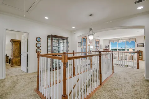 a view of a hallway with chandelier