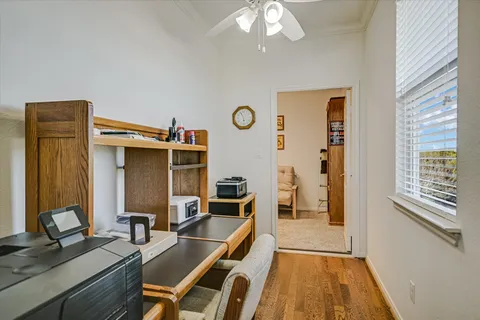 a dining room with furniture and a window