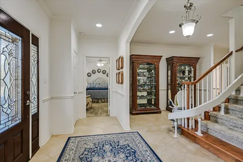 a view of entryway and hall with a rug