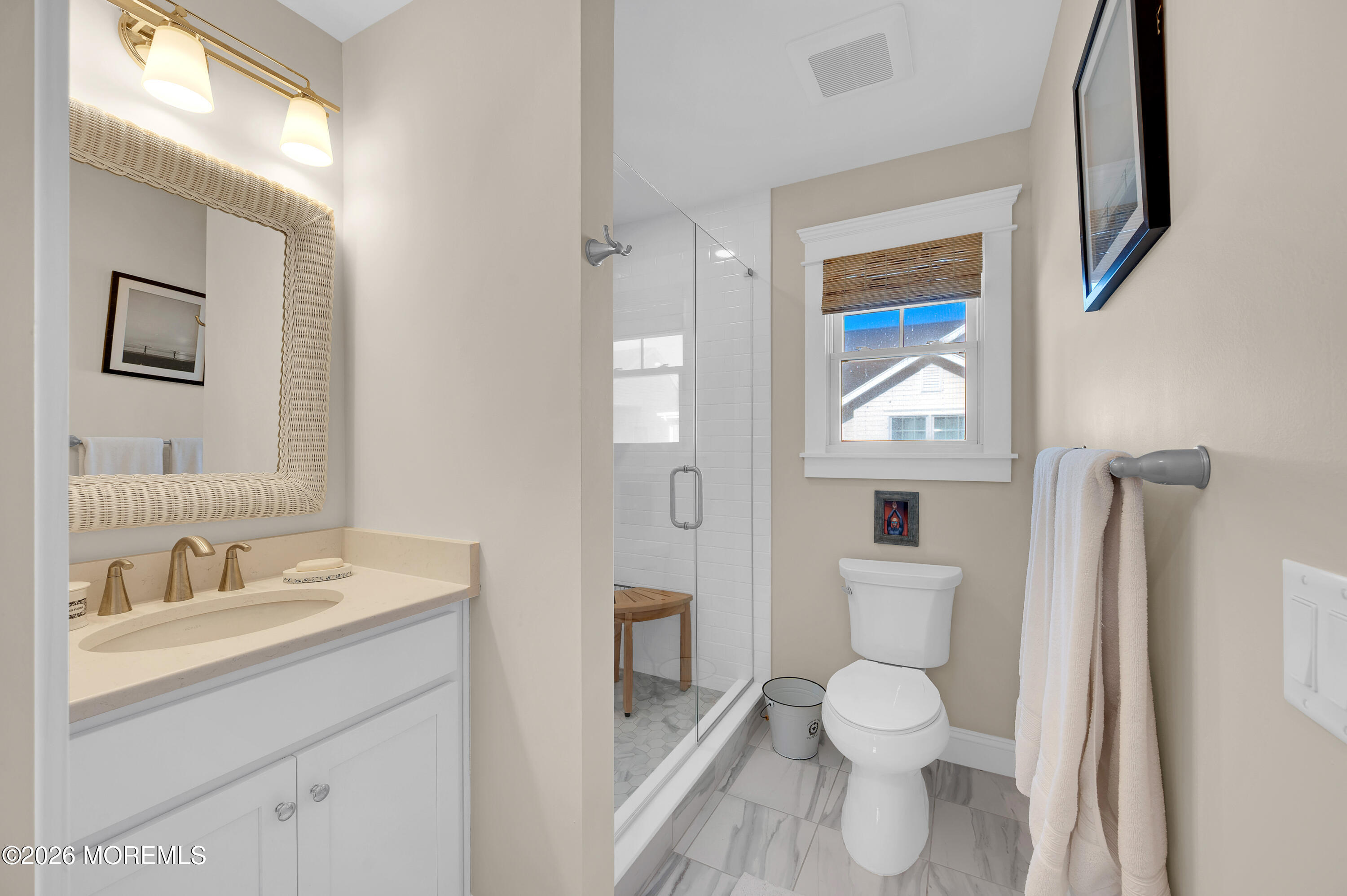 27 Shell Road, Unit 143 Mantoloking, NJ 08738 - Photo 18 of 23 a bathroom with a toilet sink and mirror