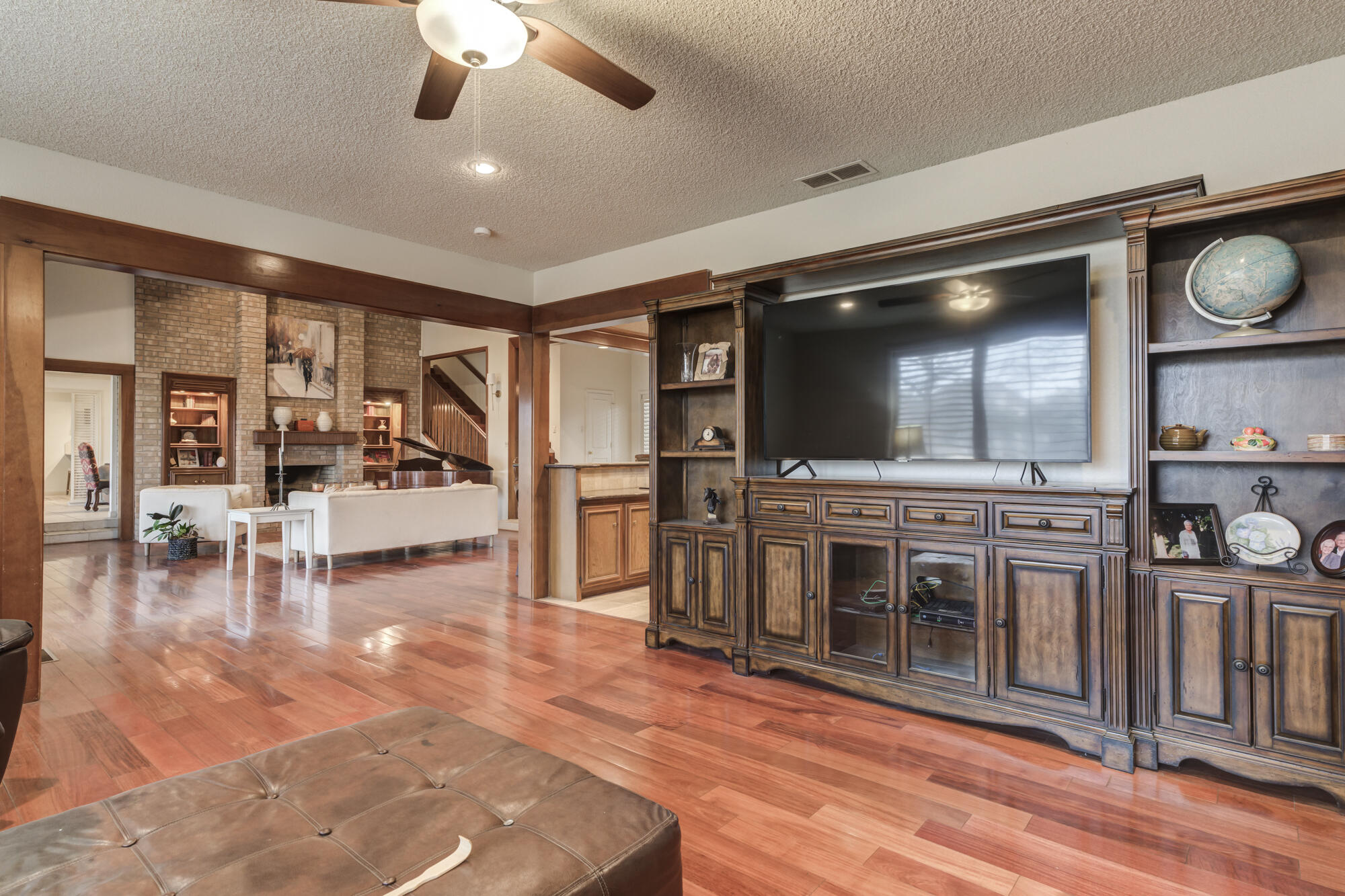 4405 89th Street Lubbock, TX 79424 - Photo 16 of 71 a living room with furniture and a flat screen tv