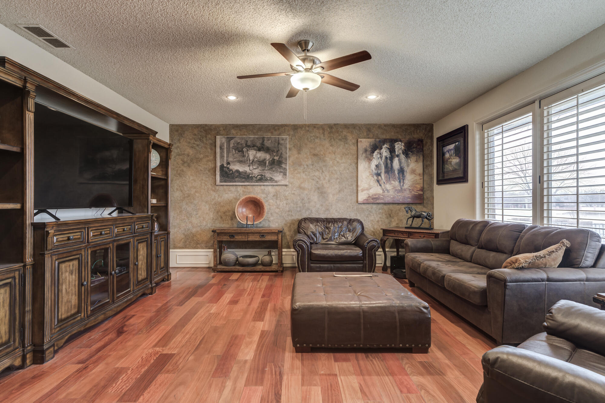 4405 89th Street Lubbock, TX 79424 - Photo 17 of 71 a living room with furniture and a flat screen tv