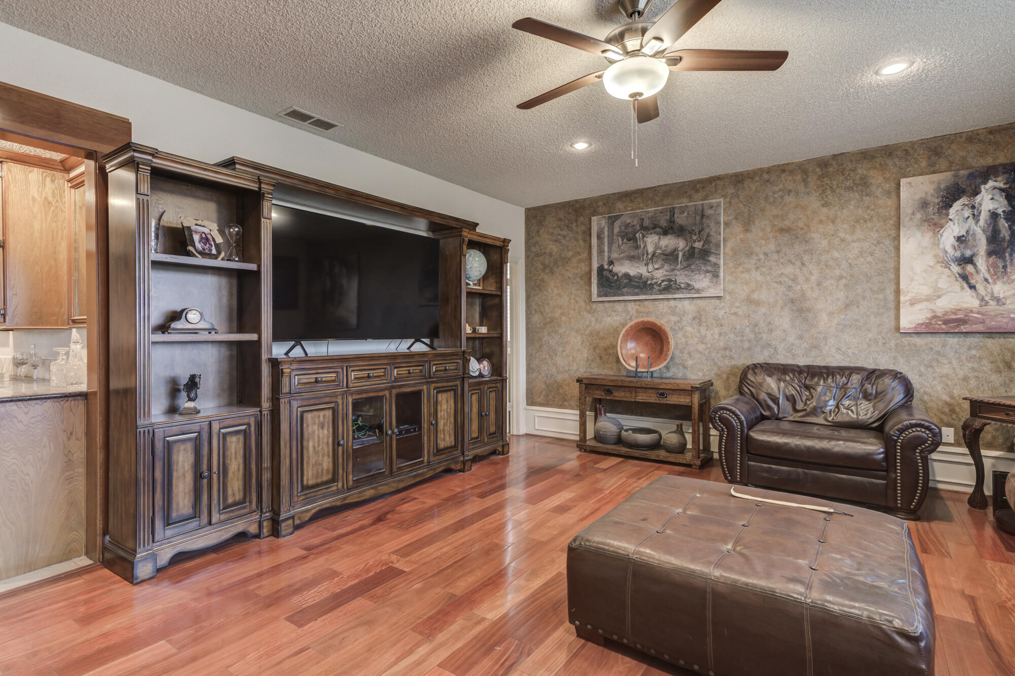 4405 89th Street Lubbock, TX 79424 - Photo 18 of 71 a living room with furniture and a flat screen tv