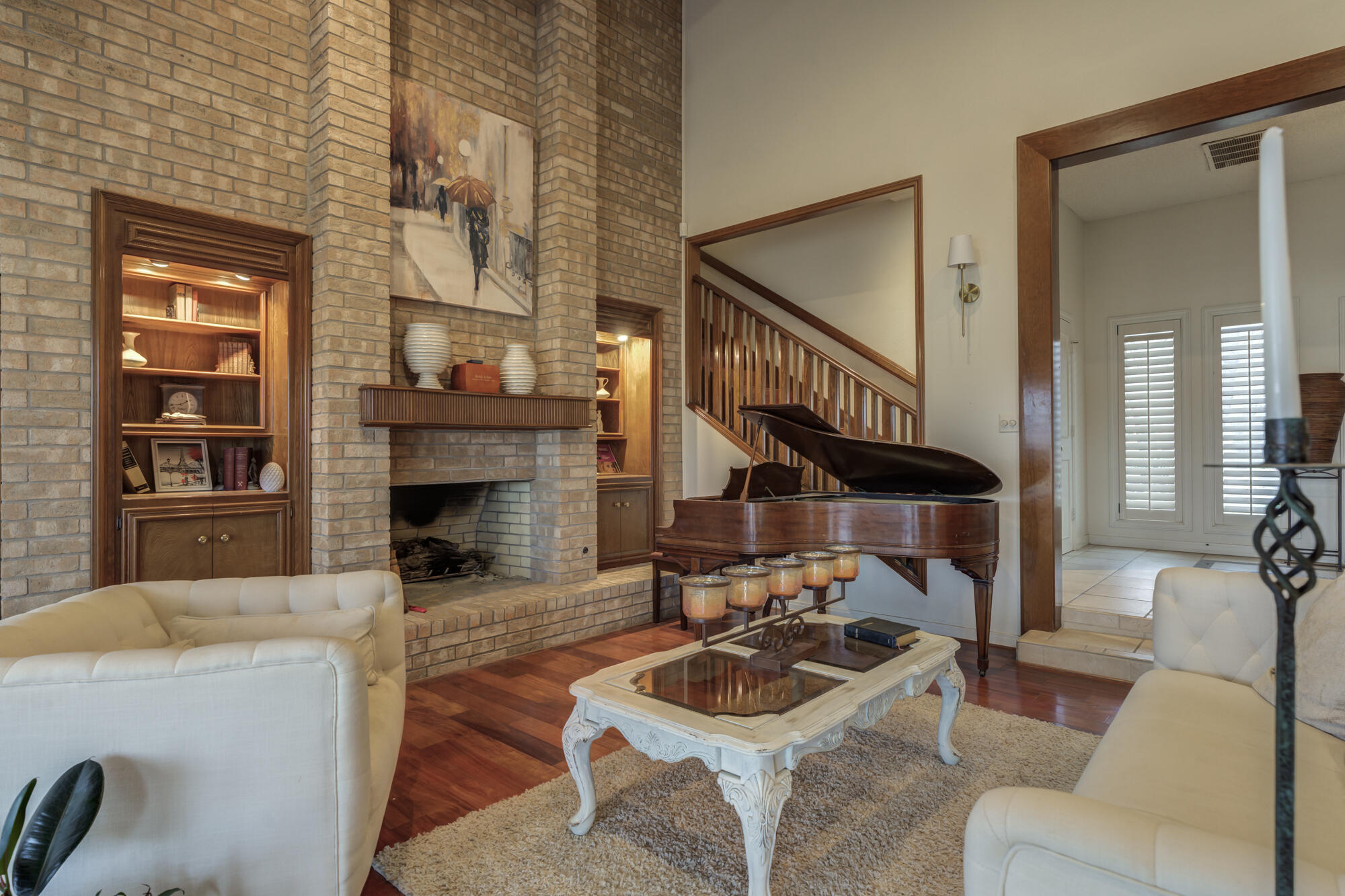 4405 89th Street Lubbock, TX 79424 - Photo 2 of 71 a living room with furniture a fireplace and a large mirror