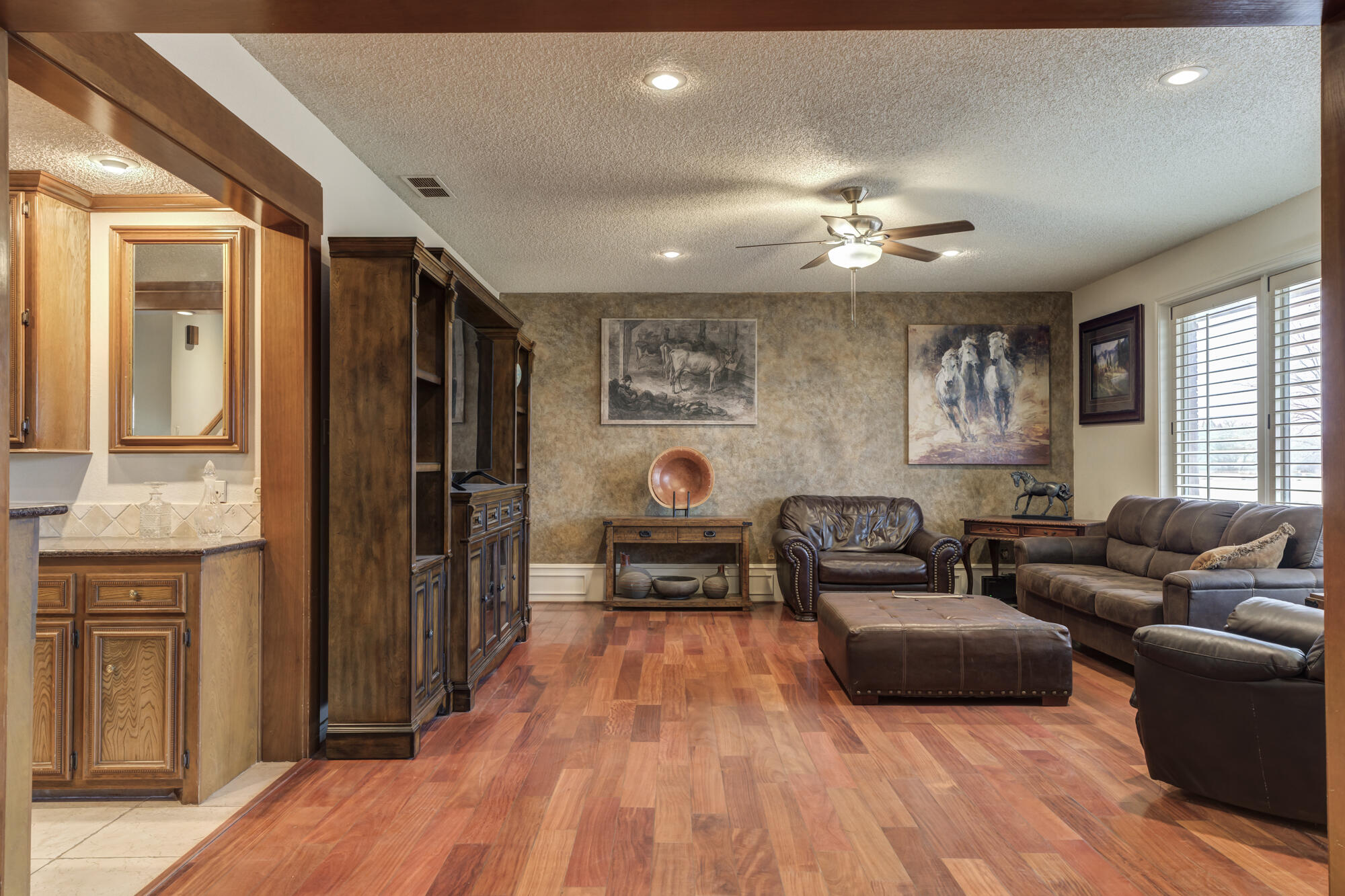 4405 89th Street Lubbock, TX 79424 - Photo 31 of 71 a living room with furniture and a wooden floor