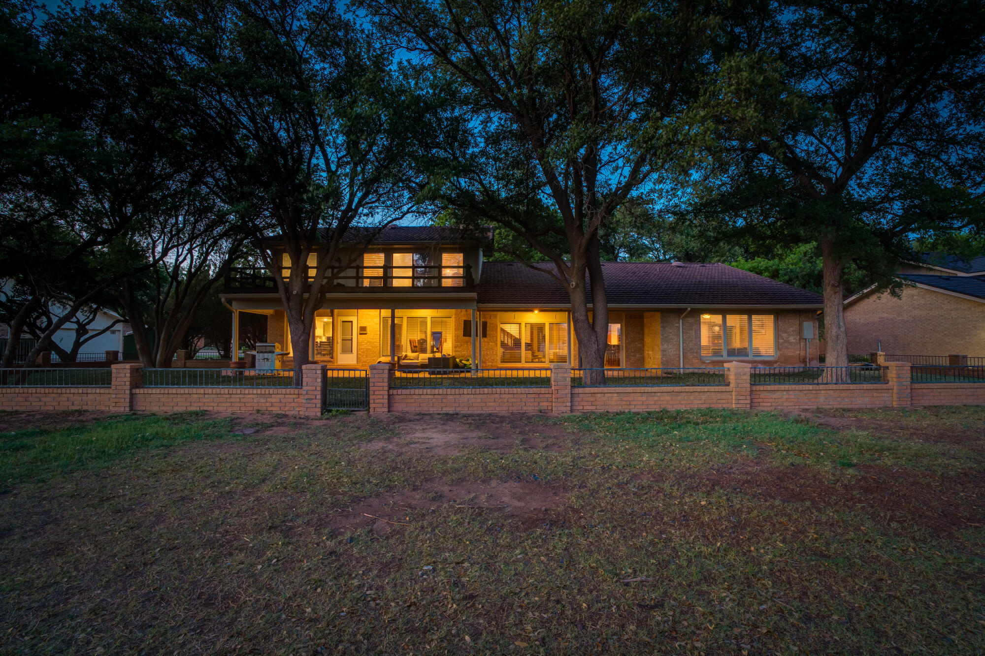 4405 89th Street Lubbock, TX 79424 - Photo 5 of 71 a view of a house with large trees