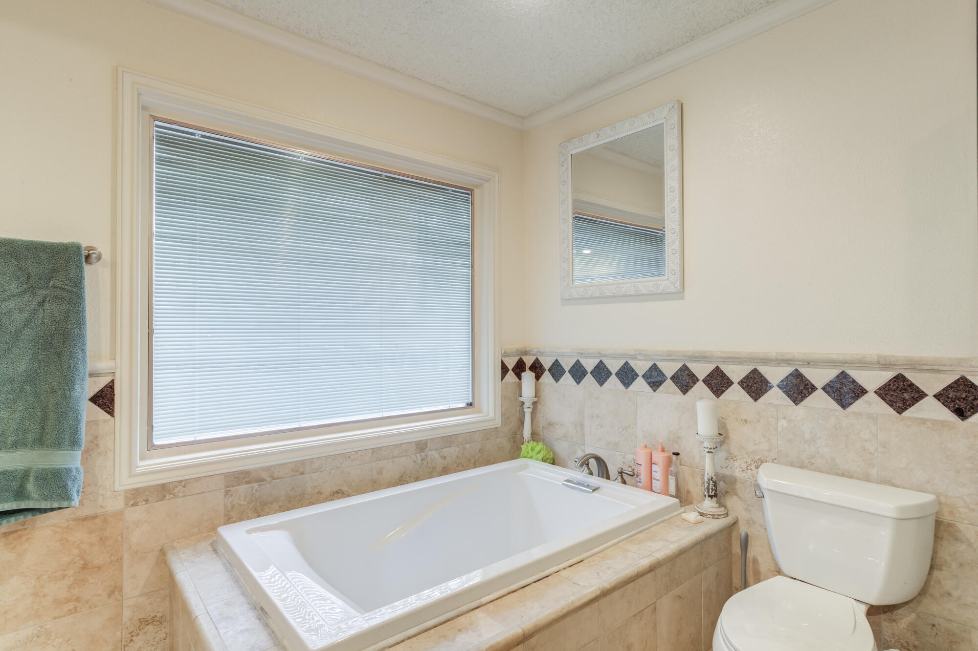 4405 89th Street Lubbock, TX 79424 - Photo 51 of 71 a bathroom with a sink and a toilet