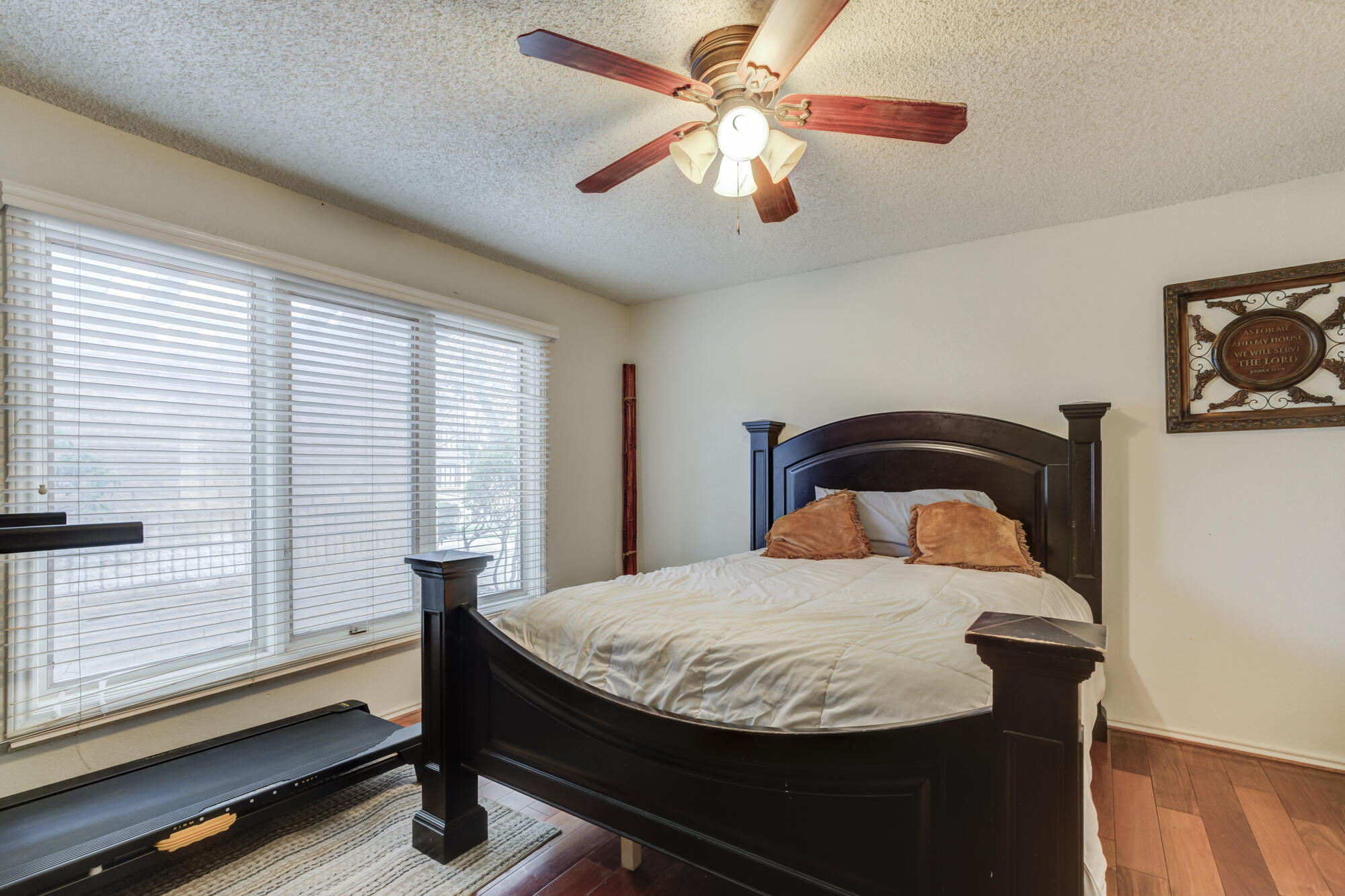 4405 89th Street Lubbock, TX 79424 - Photo 55 of 71 a bedroom with a bed and a large window with wooden floor