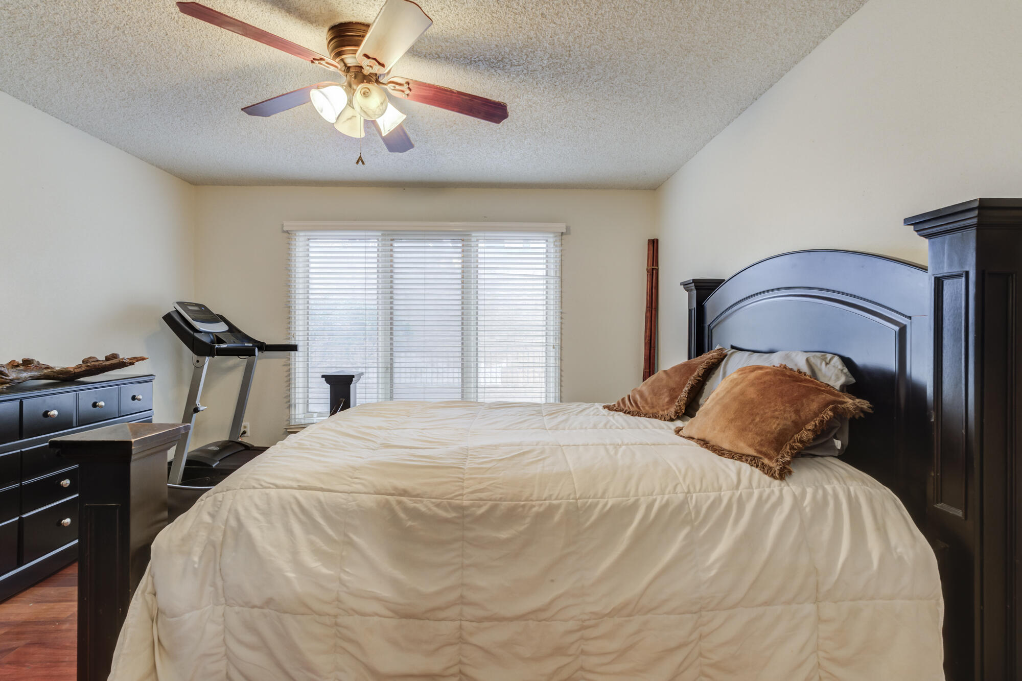 4405 89th Street Lubbock, TX 79424 - Photo 56 of 71 a bedroom with a bed and a chandelier