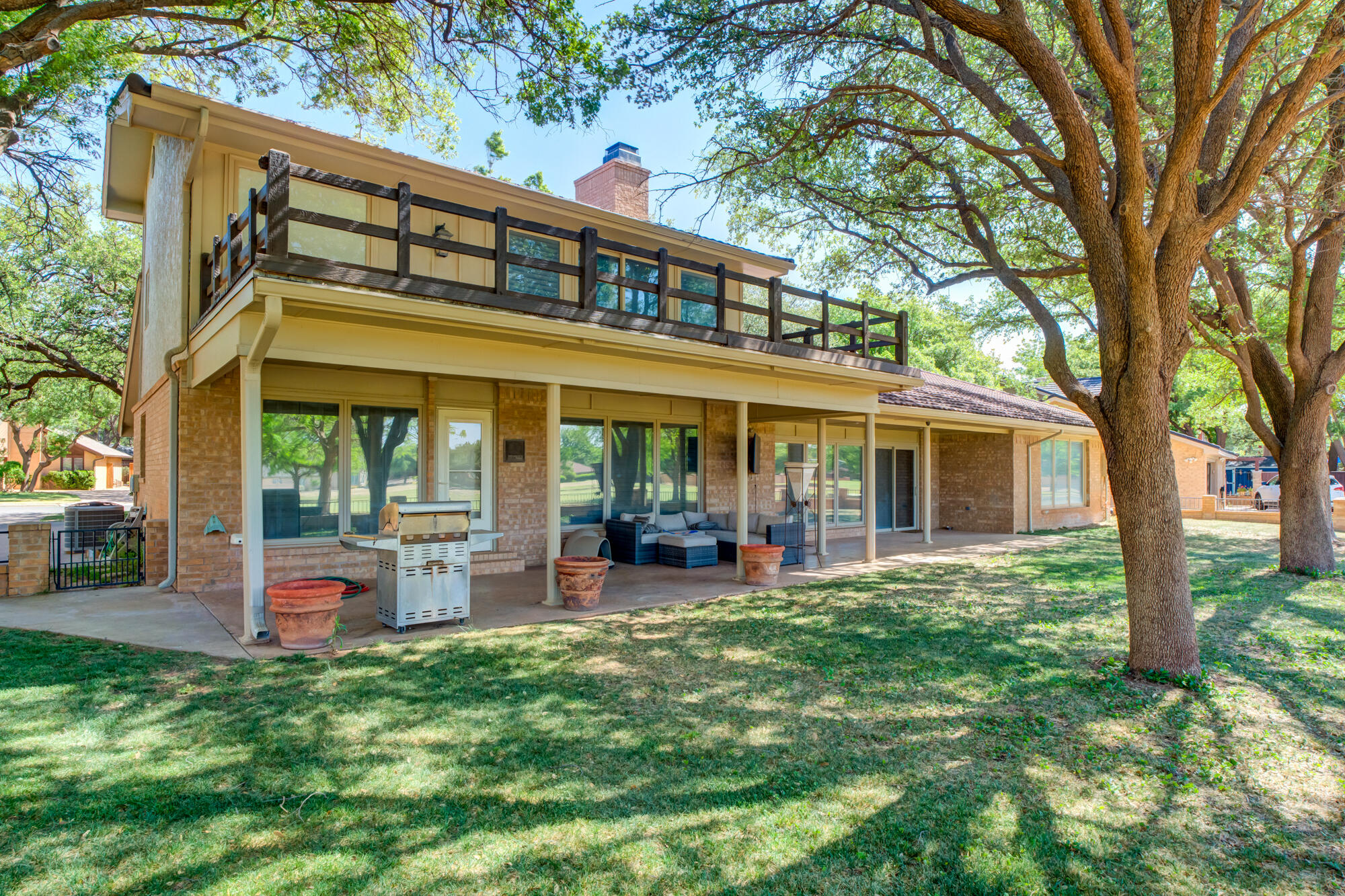 4405 89th Street Lubbock, TX 79424 - Photo 66 of 71 a front view of a house with a garden and porch