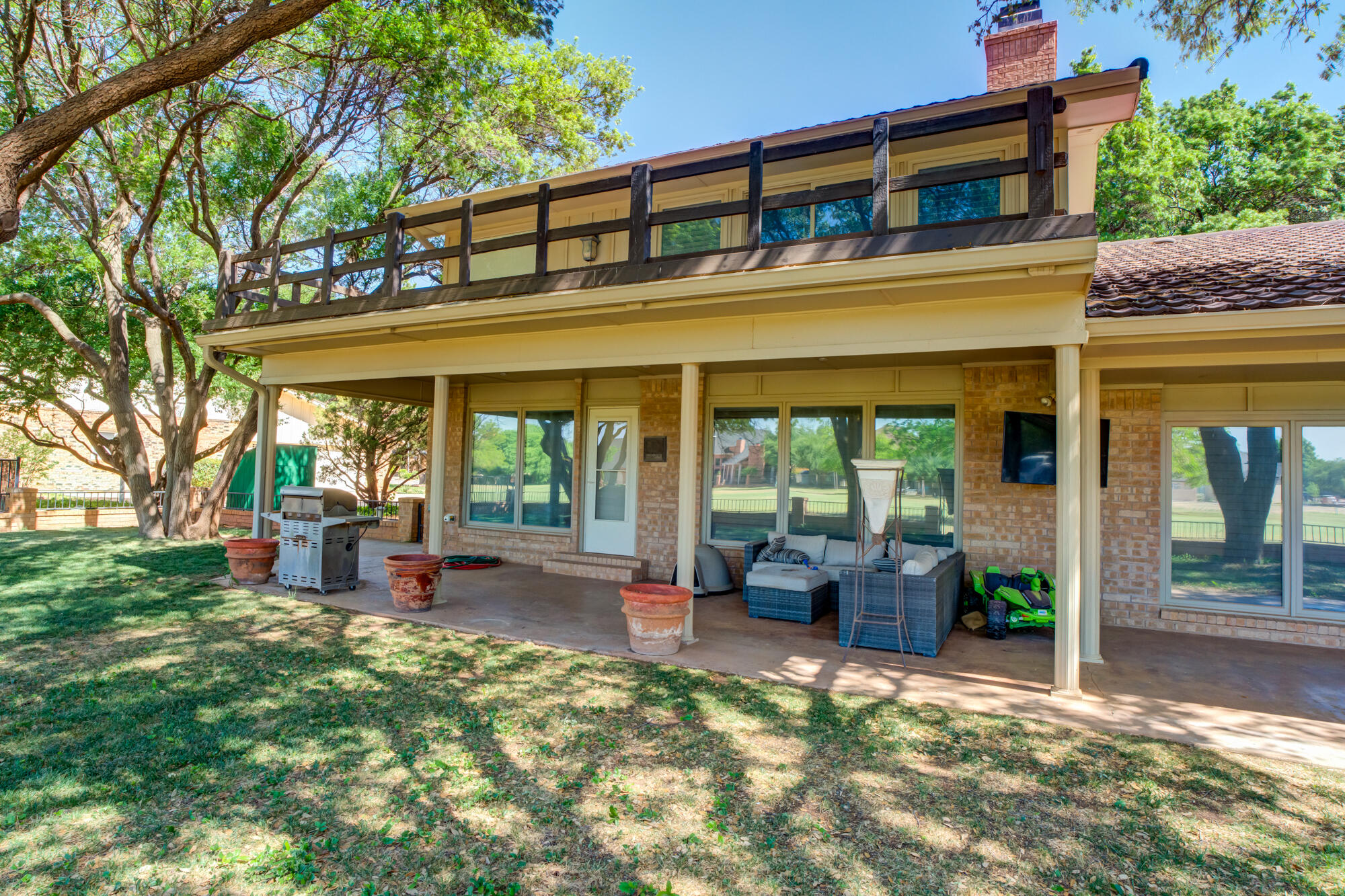 4405 89th Street Lubbock, TX 79424 - Photo 67 of 71 a front view of a house with garden and porch