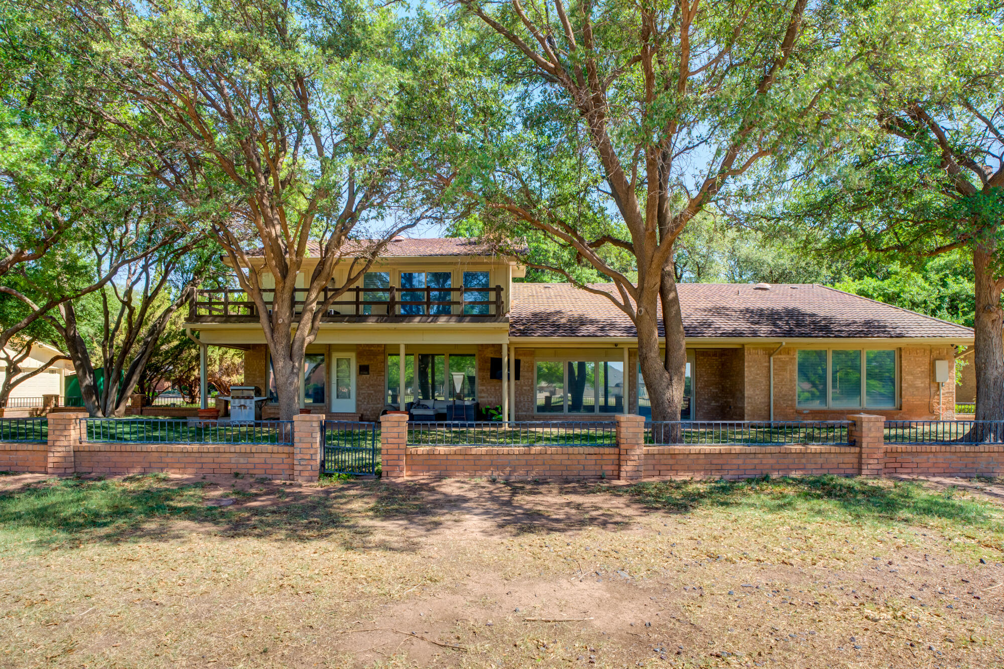 4405 89th Street Lubbock, TX 79424 - Photo 68 of 71 a front view of a house with a yard