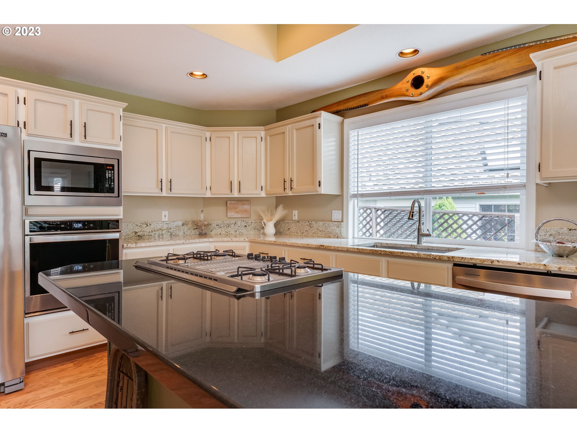 14029 Southeast 35th Loop Vancouver, WA 98683 - Photo 14 of 48 a kitchen with stainless steel appliances granite countertop a sink stove and microwave