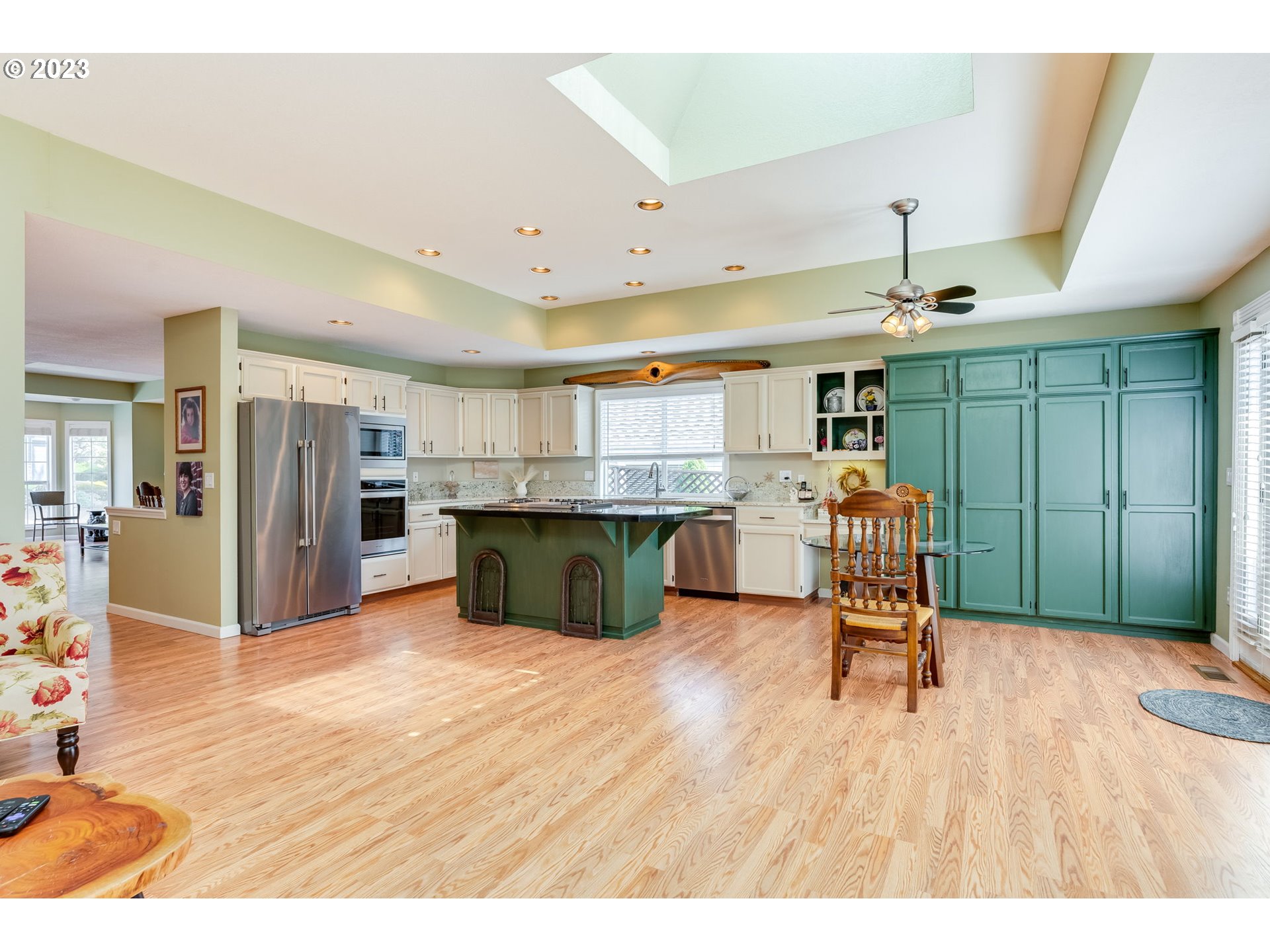 14029 Southeast 35th Loop Vancouver, WA 98683 - Photo 17 of 48 a open kitchen with stainless steel appliances kitchen island granite countertop a refrigerator and a sink