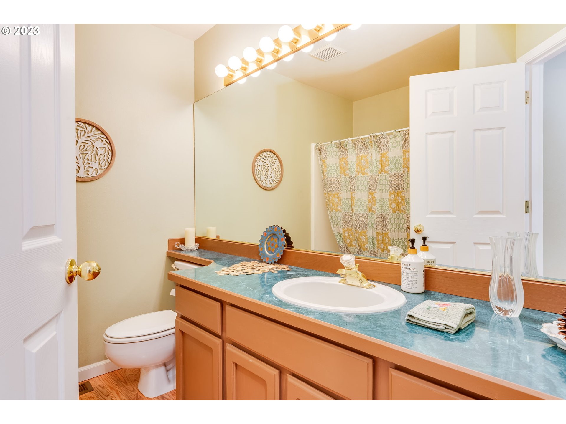 14029 Southeast 35th Loop Vancouver, WA 98683 - Photo 28 of 48 a bathroom with a granite countertop sink toilet and a mirror