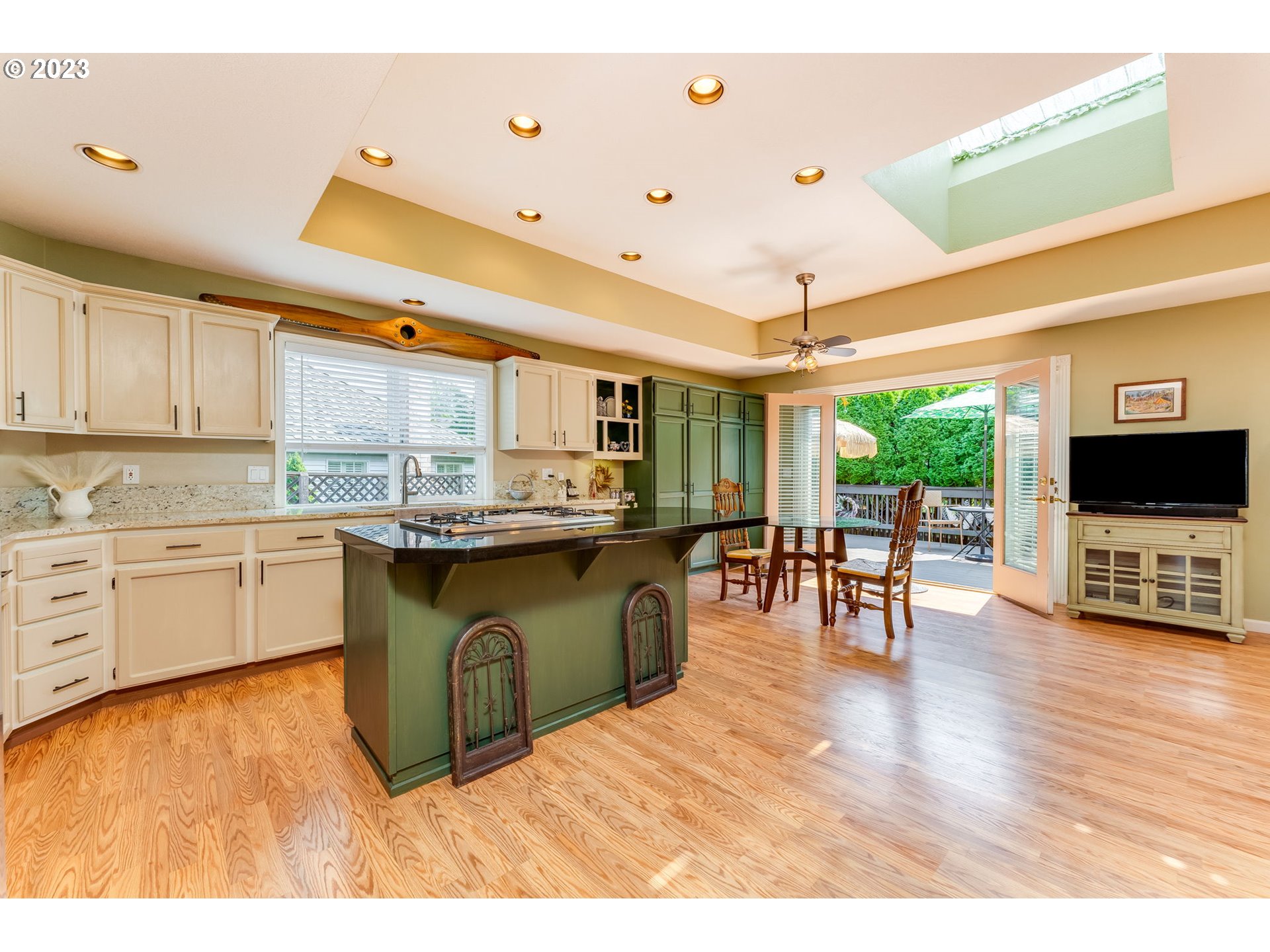 14029 Southeast 35th Loop Vancouver, WA 98683 - Photo 10 of 48 a kitchen with stainless steel appliances granite countertop a stove top oven a sink dishwasher and white cabinets with wooden floor
