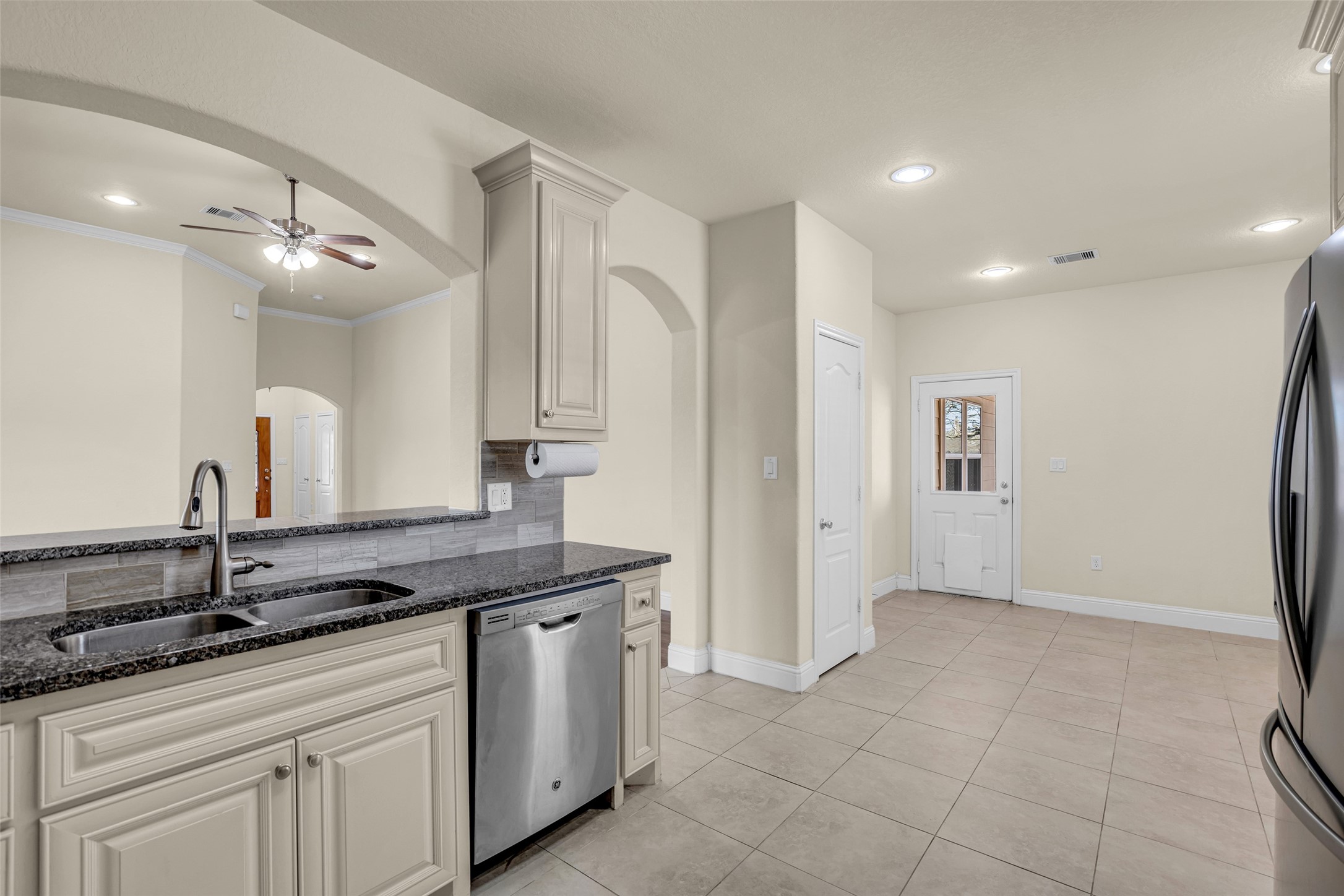 323 Texas Avenue Arcola, TX 77583 - Photo 14 of 27 a spacious bathroom with a granite countertop sink a mirror and shower