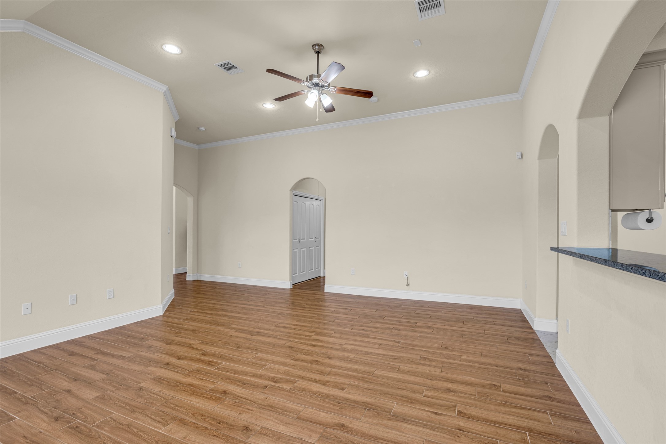 323 Texas Avenue Arcola, TX 77583 - Photo 9 of 27 a view of an empty room with wooden floor