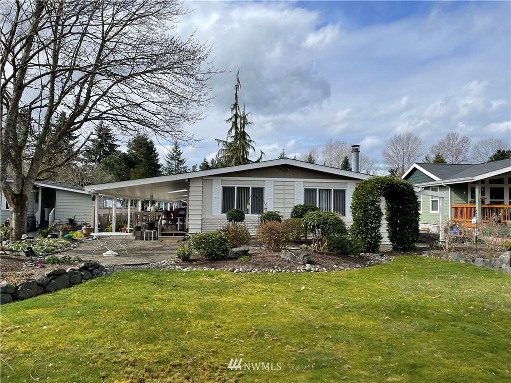 23917 Lake Drive West Bothell, WA 98021 - Photo 1 of 1 a front view of house with yard and outdoor seating