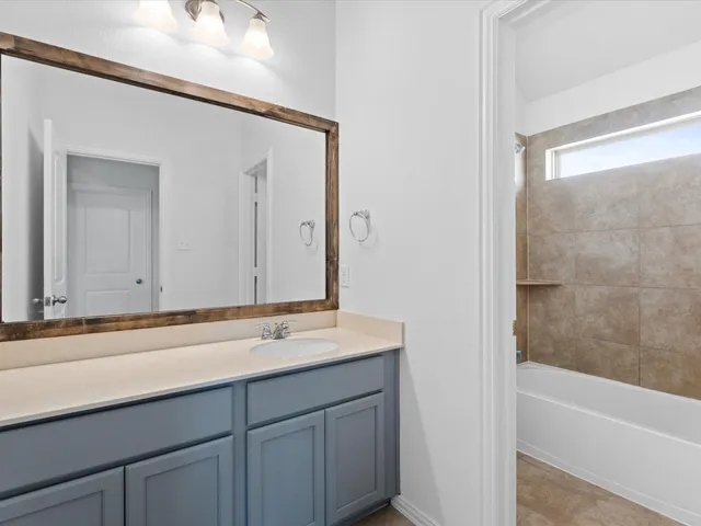 a bathroom with a sink and a bathtub
