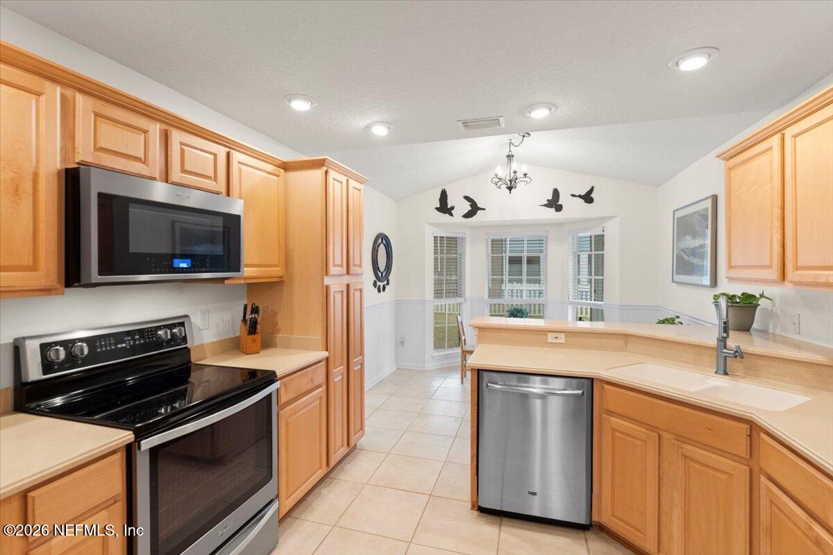 1489 Marshview Court Atlantic Beach, FL 32233 - Photo 15 of 47 a kitchen with stainless steel appliances granite countertop a sink and a stove