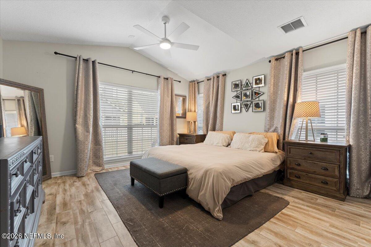 1489 Marshview Court Atlantic Beach, FL 32233 - Photo 18 of 47 a bedroom with a large bed and a window