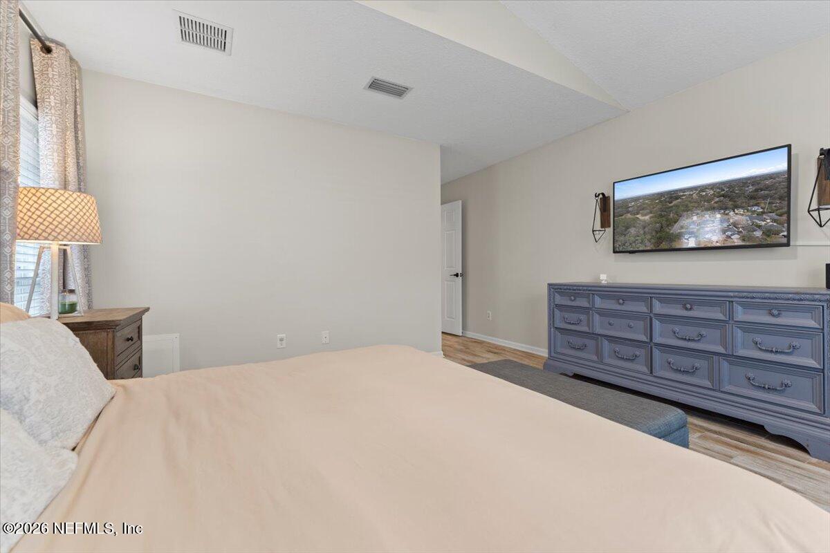 1489 Marshview Court Atlantic Beach, FL 32233 - Photo 20 of 47 a bedroom with a bed and a flat screen tv