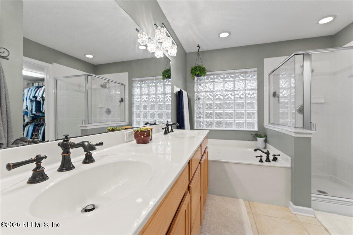 1489 Marshview Court Atlantic Beach, FL 32233 - Photo 21 of 47 a bathroom with a tub sink and mirror