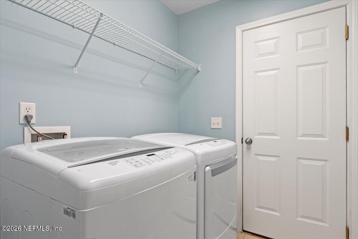 1489 Marshview Court Atlantic Beach, FL 32233 - Photo 23 of 47 a utility room with dryer and washer