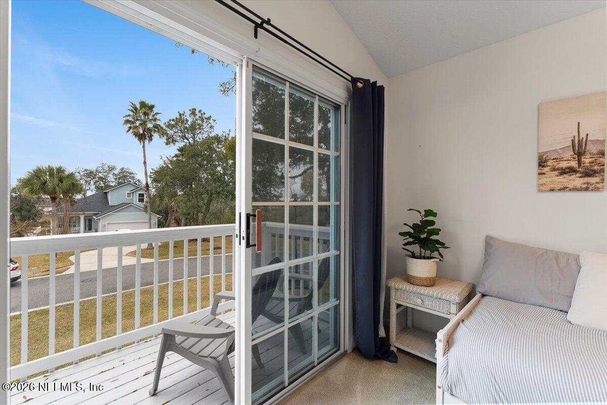 1489 Marshview Court Atlantic Beach, FL 32233 - Photo 28 of 47 a balcony view with a potted plant and a bench