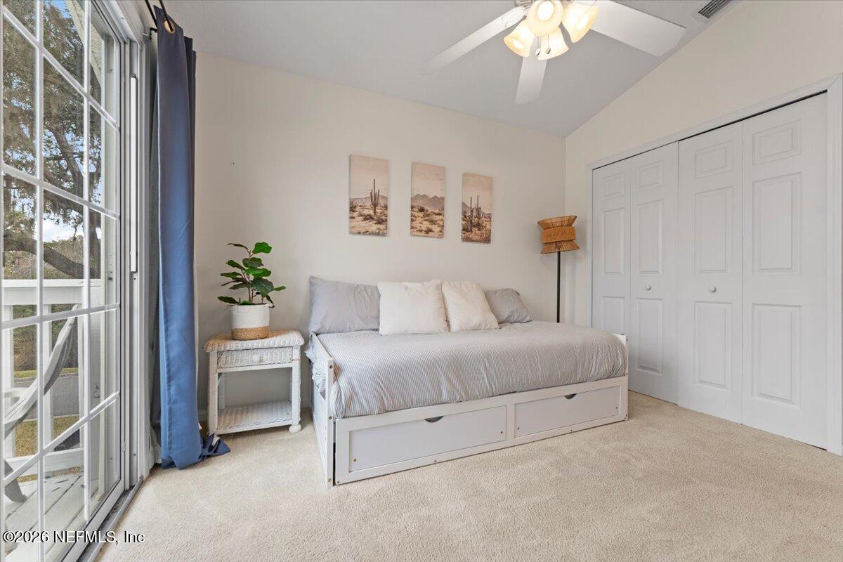 1489 Marshview Court Atlantic Beach, FL 32233 - Photo 29 of 47 a room with a bed and a chandelier