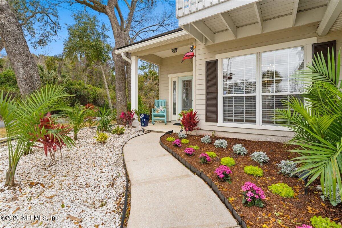 1489 Marshview Court Atlantic Beach, FL 32233 - Photo 3 of 47 a flower garden in front of a door
