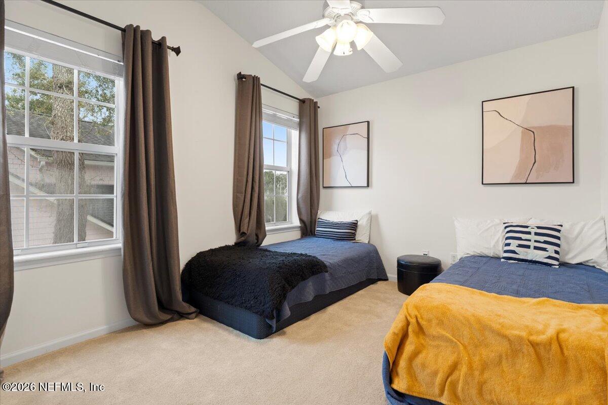 1489 Marshview Court Atlantic Beach, FL 32233 - Photo 31 of 47 a bedroom with two beds and a large window