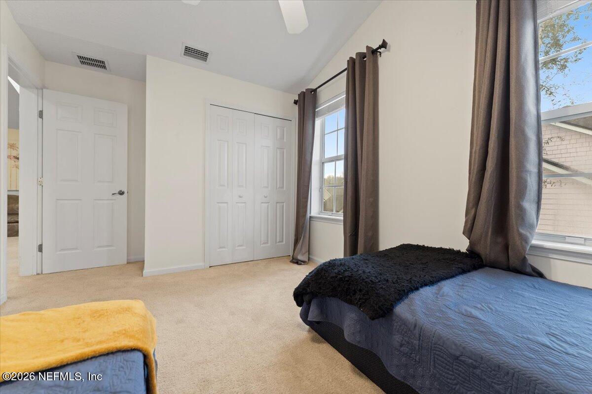 1489 Marshview Court Atlantic Beach, FL 32233 - Photo 32 of 47 a bedroom with a bed and a window
