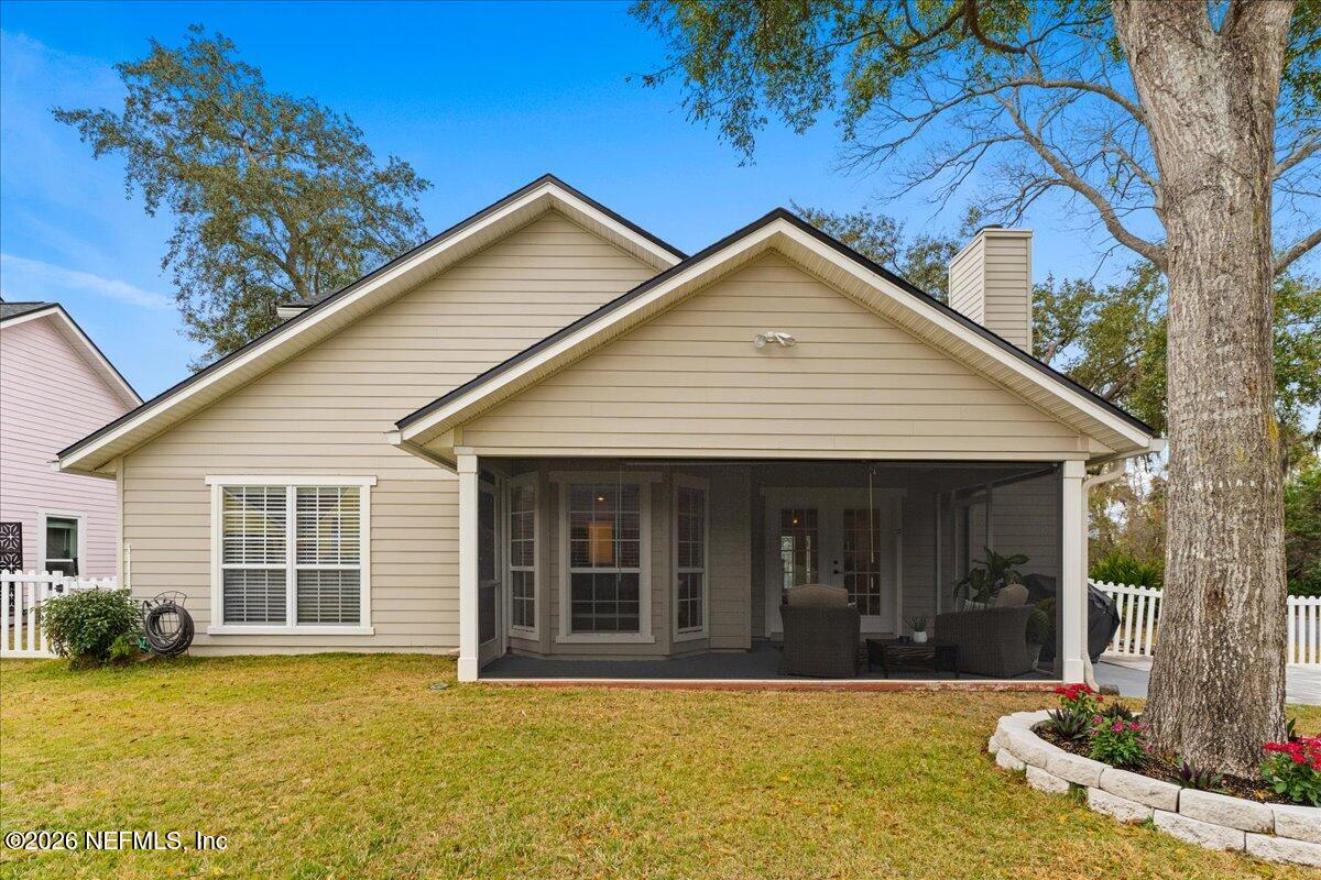 1489 Marshview Court Atlantic Beach, FL 32233 - Photo 38 of 47 a view of a house with a yard outdoor seating and covered with trees