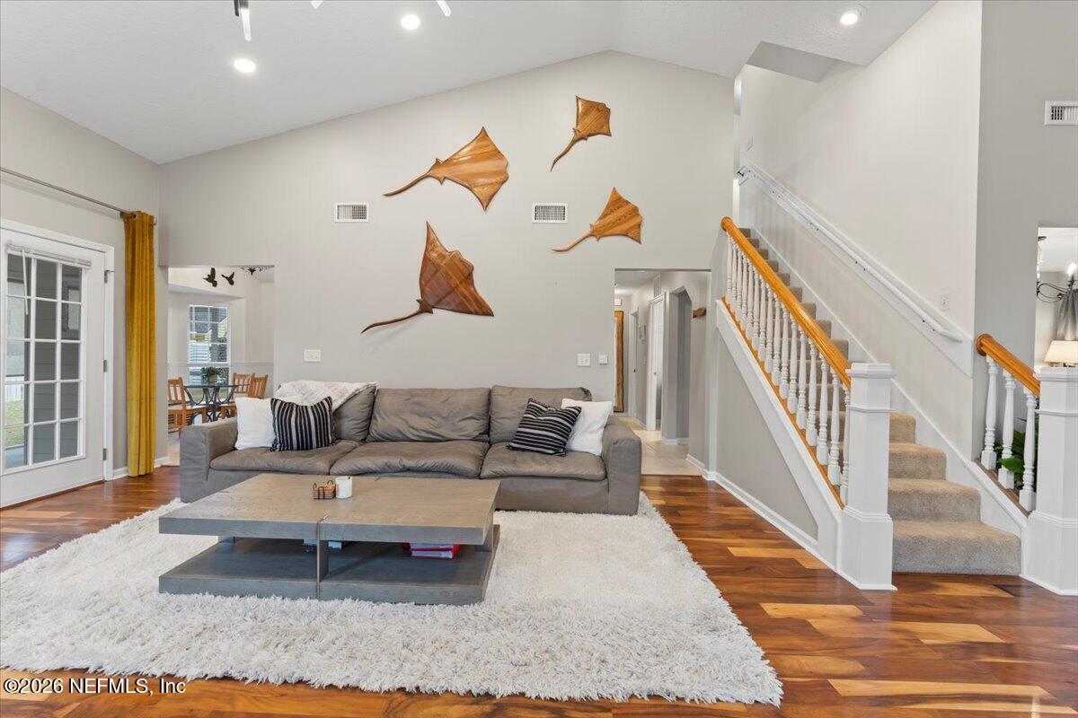 1489 Marshview Court Atlantic Beach, FL 32233 - Photo 9 of 47 a living room with furniture and wooden floor
