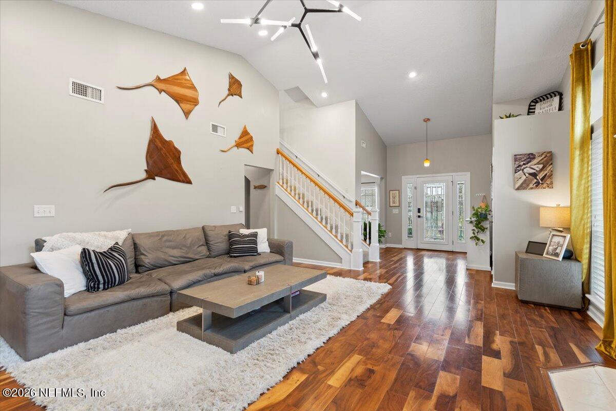 1489 Marshview Court Atlantic Beach, FL 32233 - Photo 10 of 47 a living room with furniture and wooden floor