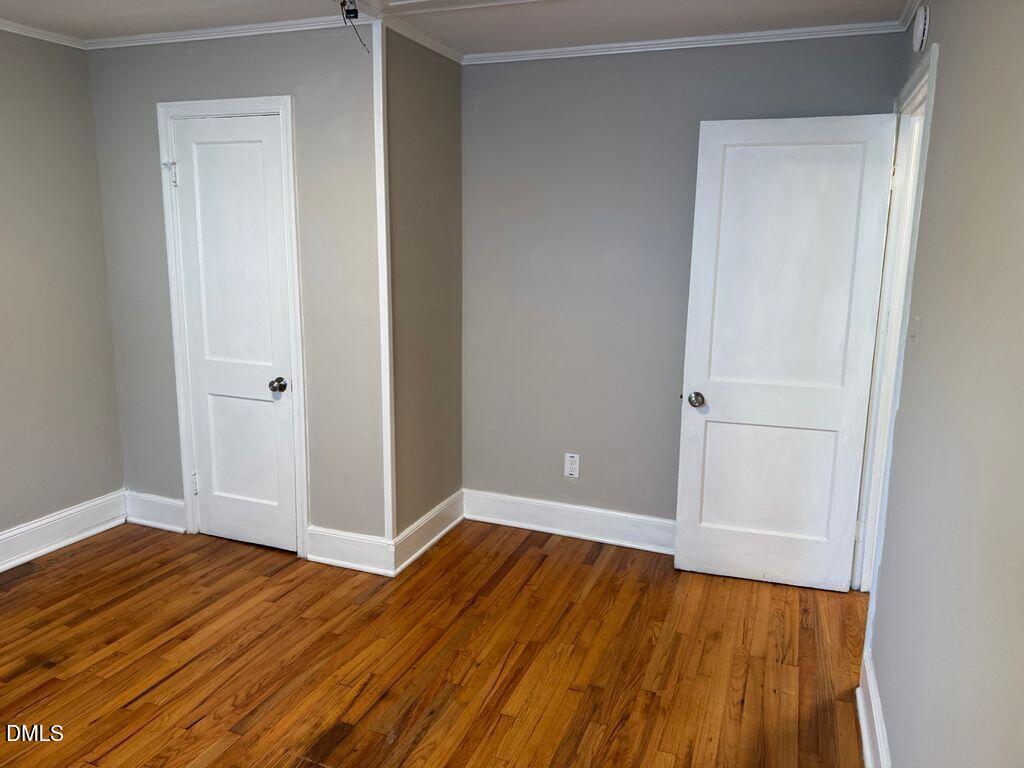 619 Old Oxford Road Durham, NC 27704 - Photo 11 of 22 an empty room with wooden floor and closet