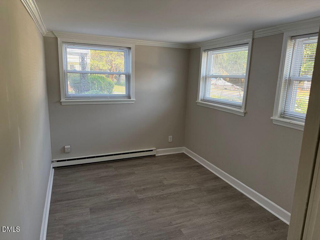 619 Old Oxford Road Durham, NC 27704 - Photo 14 of 22 wooden floor in an empty room with a window