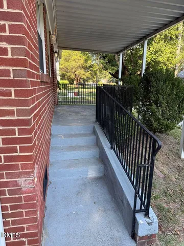 a view of a porch with wooden floor and outdoor space