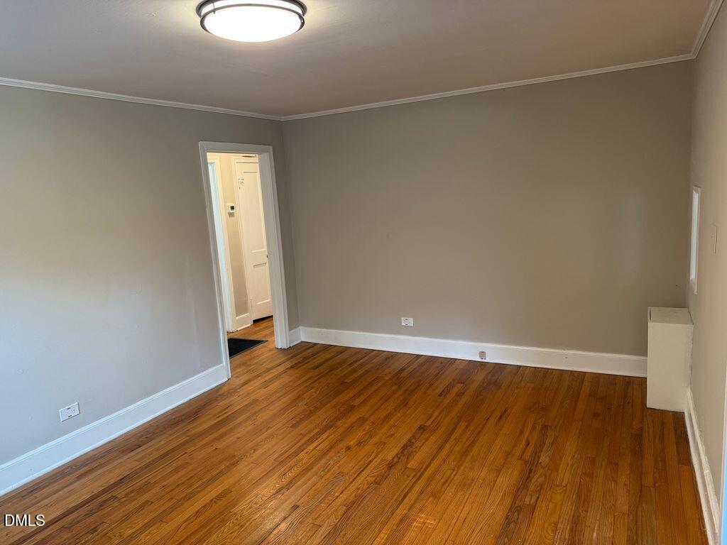 619 Old Oxford Road Durham, NC 27704 - Photo 6 of 22 a view of room with wooden floor