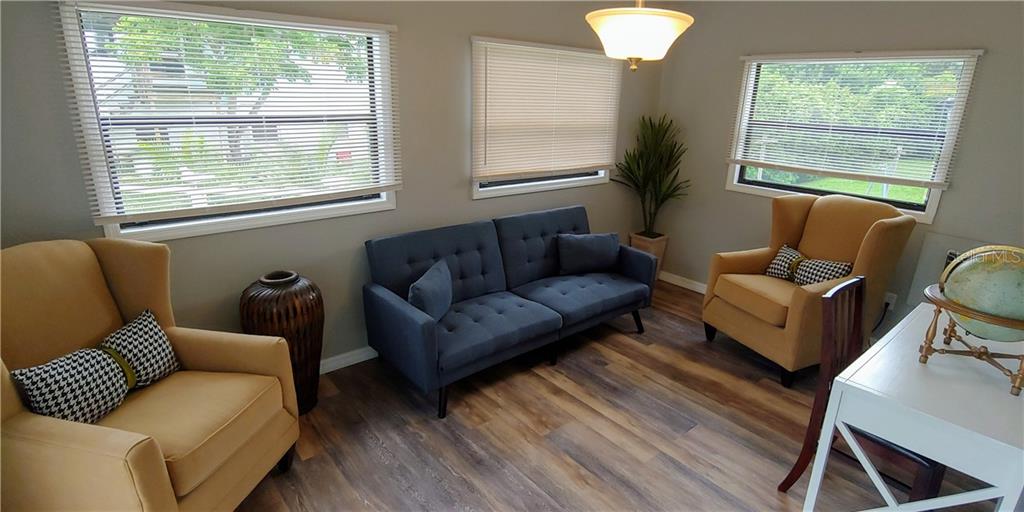 309 Shore T Road Nokomis, FL 34275 - Photo 13 of 42 a living room with furniture and a window