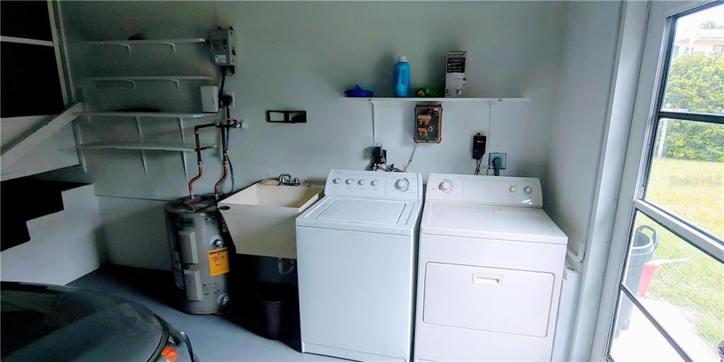 309 Shore T Road Nokomis, FL 34275 - Photo 19 of 42 a utility room with dryer and washer