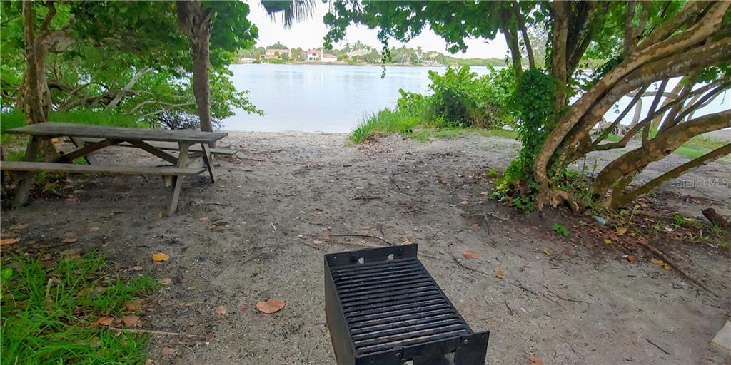 309 Shore T Road Nokomis, FL 34275 - Photo 25 of 42 a backyard of a house with lots of green space