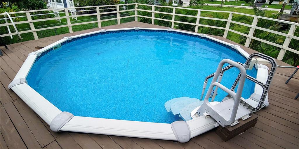 309 Shore T Road Nokomis, FL 34275 - Photo 3 of 42 a view of a room with wooden floor and windows