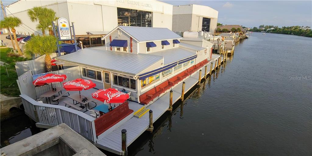 309 Shore T Road Nokomis, FL 34275 - Photo 31 of 42 an aerial view of a house roof deck outdoor seating and city view