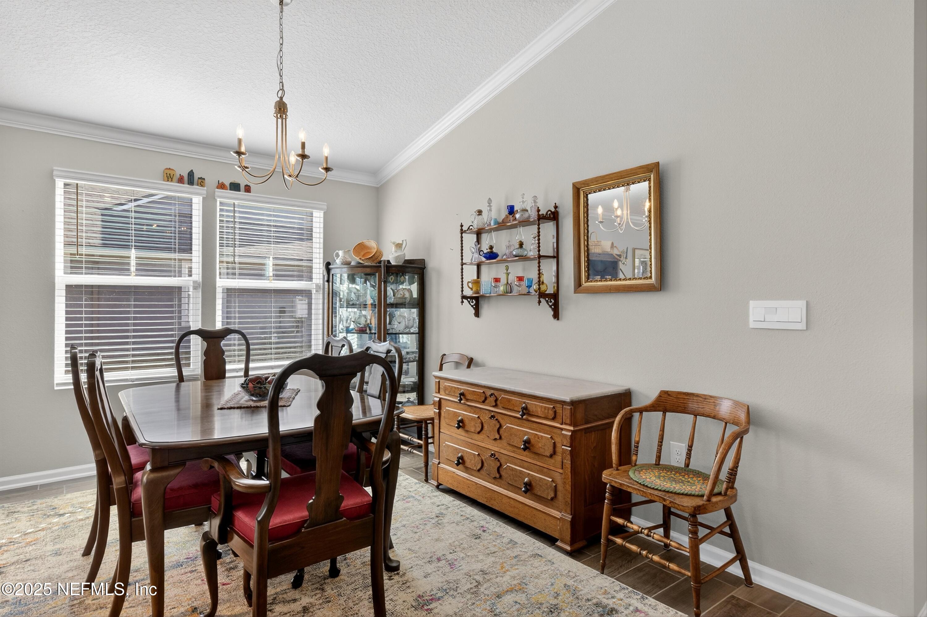 70 Spoonbill Circle St. Augustine, FL 32095 - Photo 17 of 76 a view of a dining room with furniture window and outside view