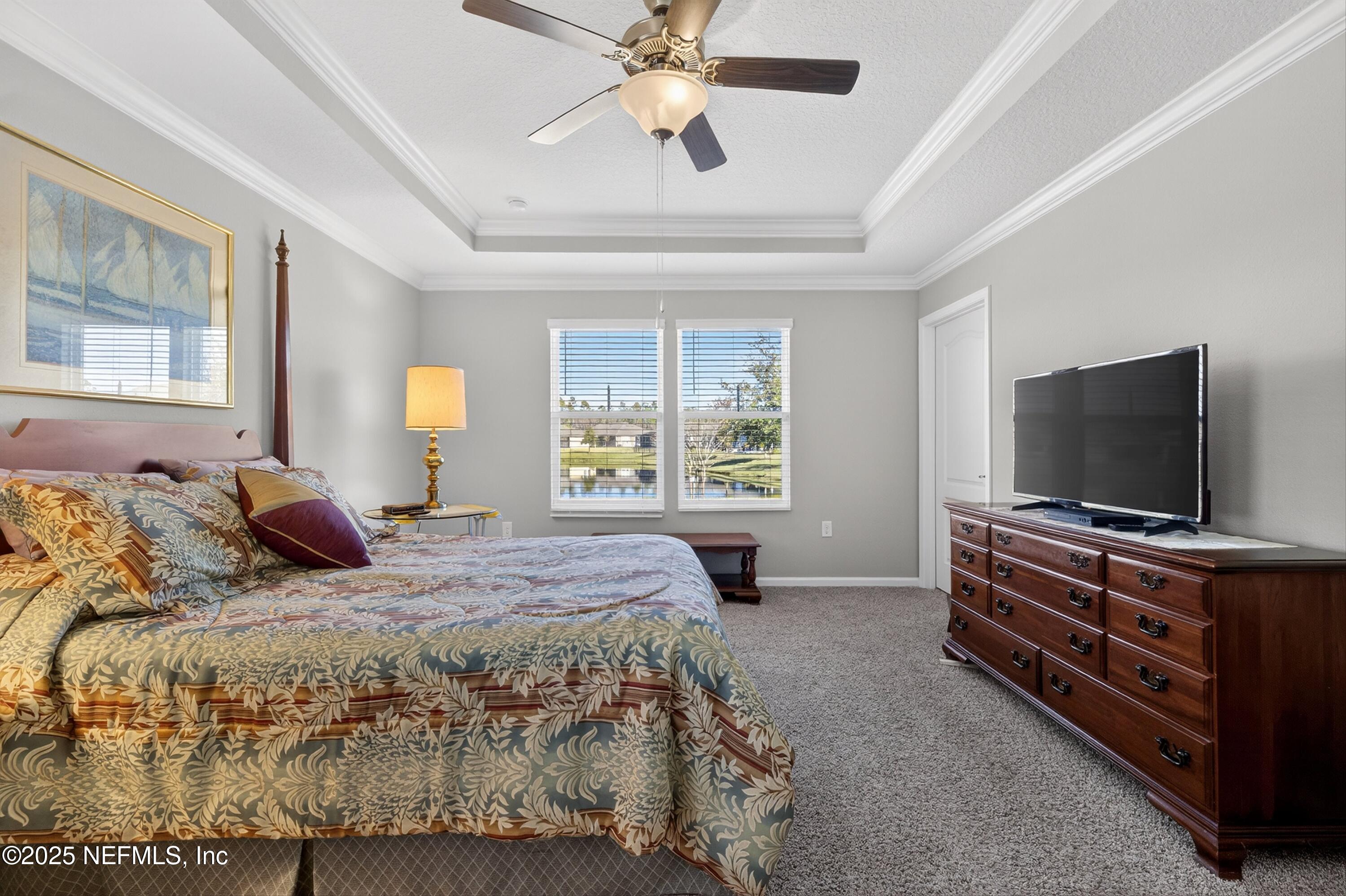 70 Spoonbill Circle St. Augustine, FL 32095 - Photo 19 of 76 a bedroom with a bed and a flat screen tv