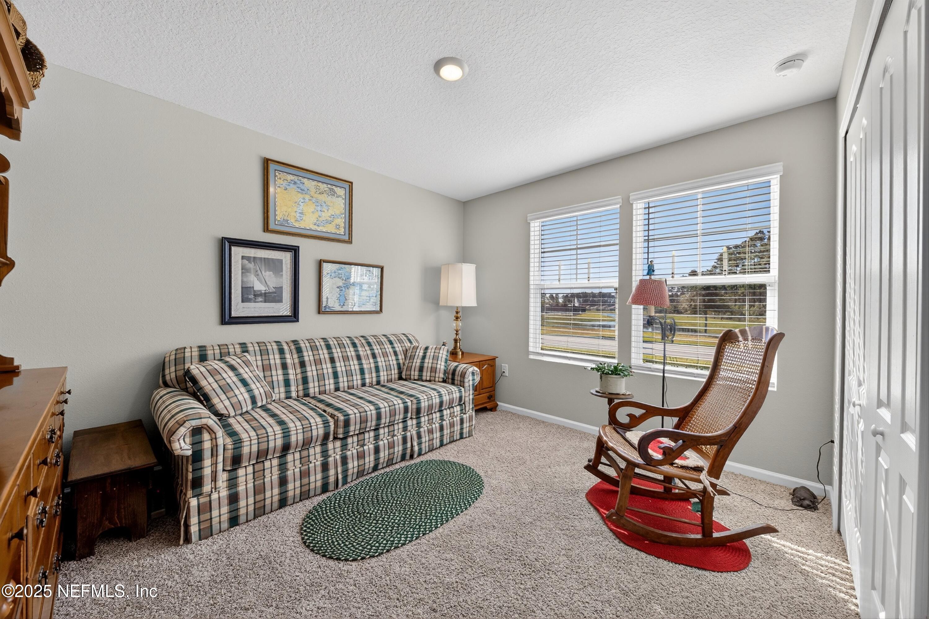 70 Spoonbill Circle St. Augustine, FL 32095 - Photo 24 of 76 a bedroom with furniture and a wooden floor