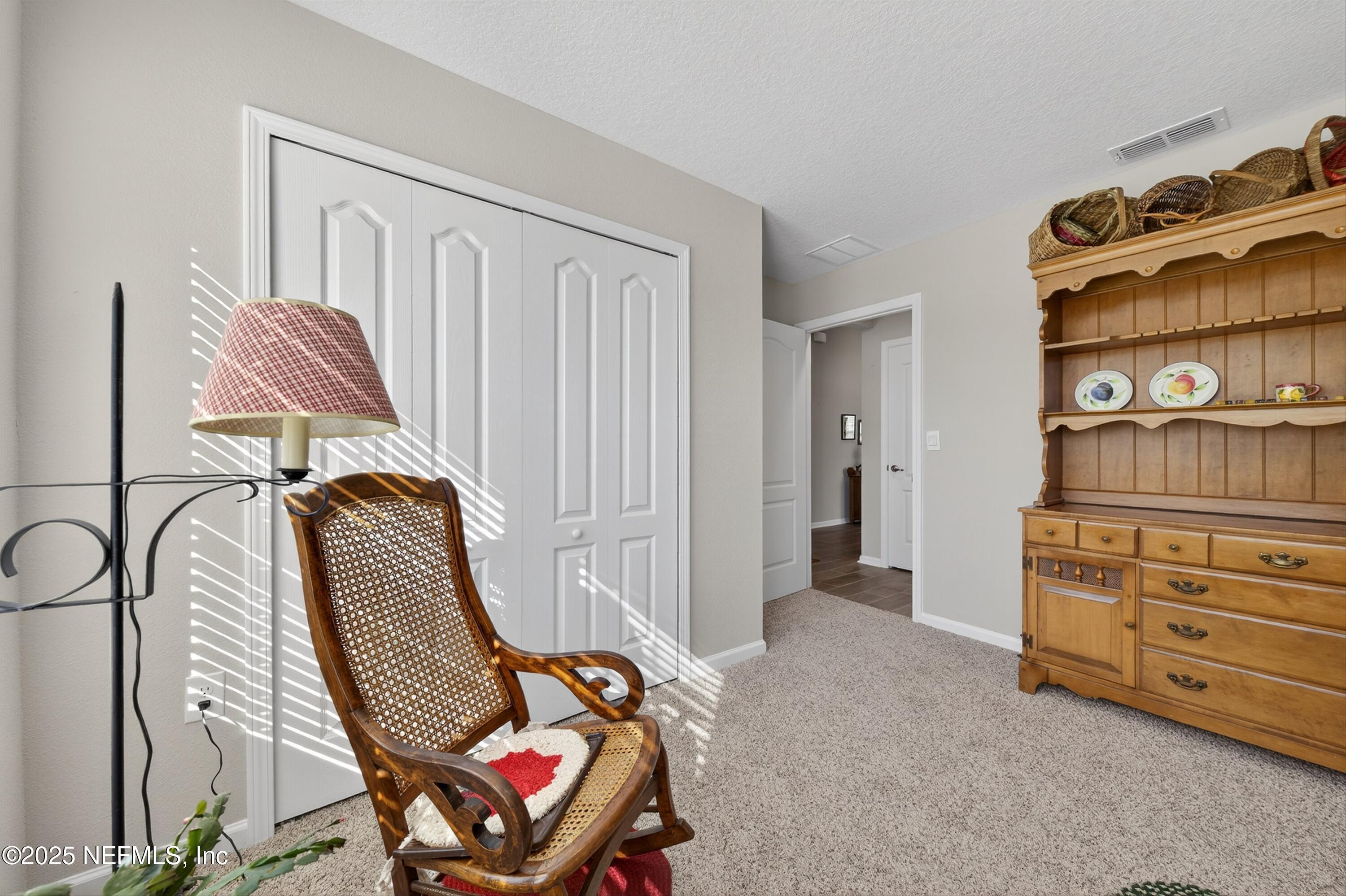70 Spoonbill Circle St. Augustine, FL 32095 - Photo 25 of 76 a view of a bedroom with lounge chair and couch